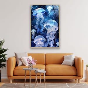 a living room with a couch and a painting on the wall