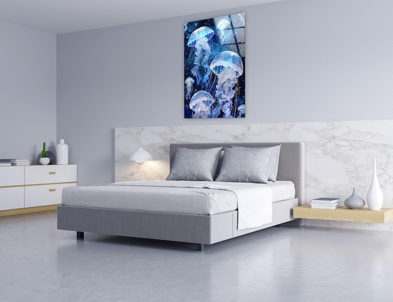 a bedroom with a bed and a painting on the wall