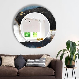 a living room with a couch and a round mirror