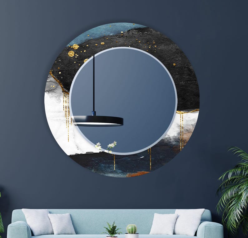 a living room with a blue couch and a round mirror