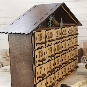 Wooden advent calendar with 24 drawers - side close up