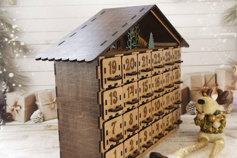 Wooden advent calendar with 24 drawers - side close up