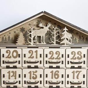 Standard, unpainted, assembled wooden Christmas calendar with 24 drawers. Suitable for self-painting - close up