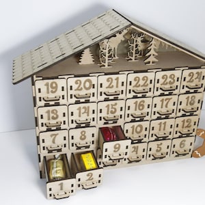 Standard, unpainted, assembled wooden Christmas calendar with 24 drawers. Suitable for self-painting. Angle view