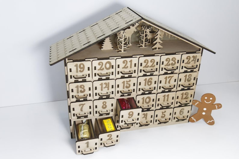 Standard, unpainted, assembled wooden Christmas calendar with 24 drawers. Suitable for self-painting. Angle view