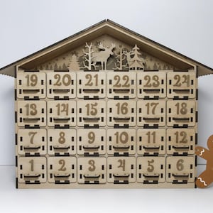 Standard, unpainted, assembled wooden Christmas calendar with 24 drawers. Suitable for self-painting