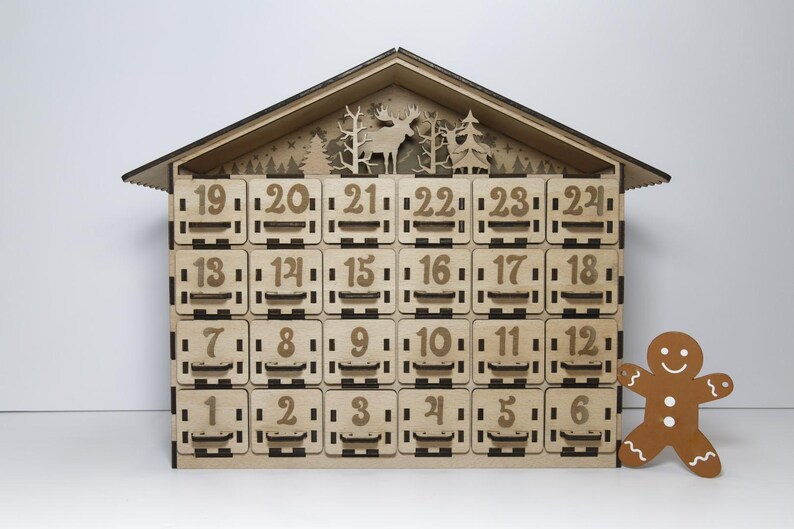 Standard, unpainted, assembled wooden Christmas calendar with 24 drawers. Suitable for self-painting