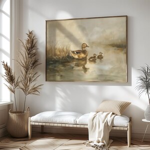 a painting hanging on the wall of a living room