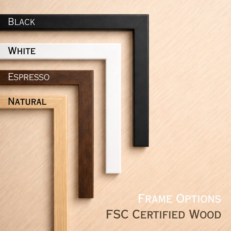 various types of wooden frames, each with a different color and finish, arranged on a wooden surface.