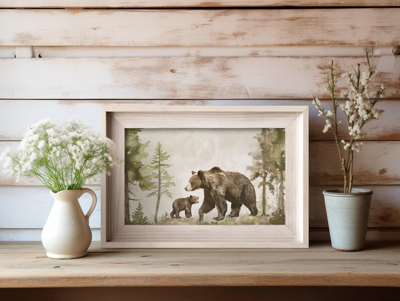 May include: A watercolor painting of a brown bear and a cub walking through a forest. The bears are walking on a path in the woods, surrounded by green trees and bushes.