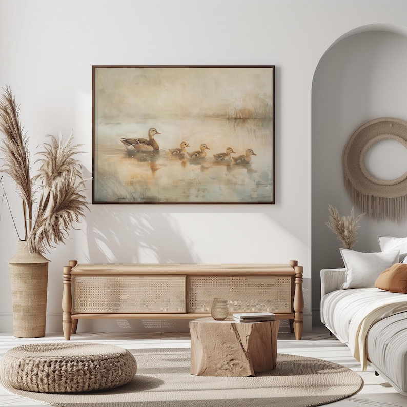 a living room with a couch and a painting on the wall