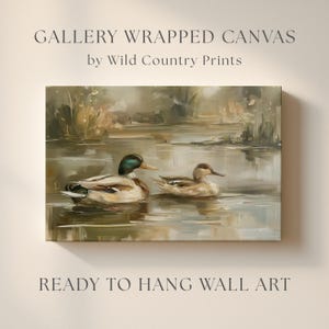 The image is a painting of two ducks swimming in a pond, with a text overlay that reads "Gallery Wrapped Canvas by Wild Country Prints" and "Ready to Hang Wall Art".