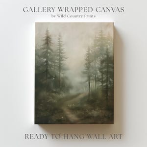 May include: Gallery wrapped canvas wall art featuring a misty forest scene with tall trees and a winding path. The artwork is by Wild Country Prints and is ready to hang. The color palette includes greens, browns, and whites.