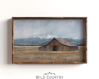 May include: A framed painting depicting a rustic wooden barn with a snow-capped mountain range in the background. The barn is painted in shades of brown and the sky is a soft blue.