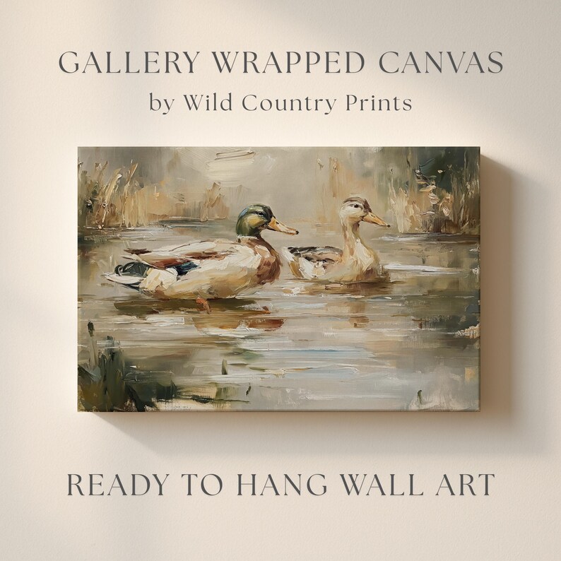 The image is a painting of two ducks swimming in a pond, with the text "GALLERY WRAPPED CANVAS by Wild Country Prints" and "READY TO HANG WALL ART" below it.