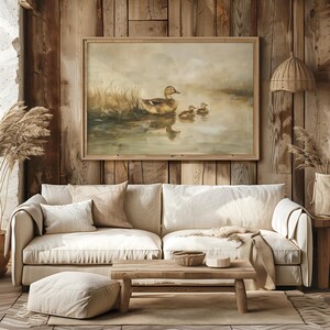 a living room with a couch and a painting on the wall