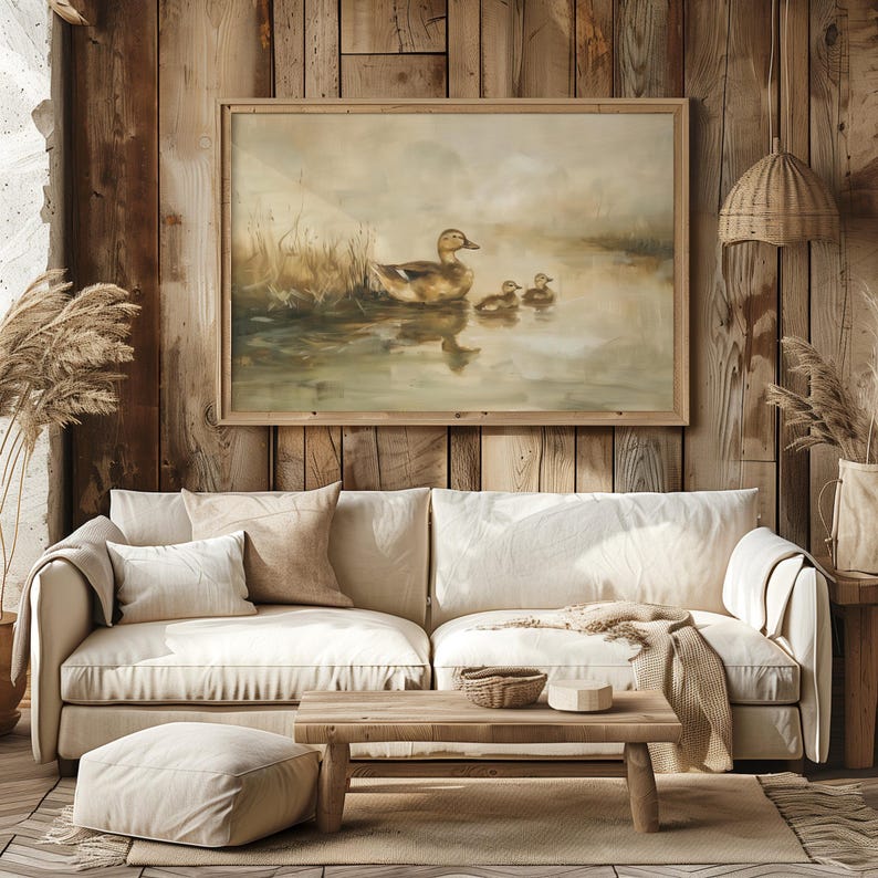 a living room with a couch and a painting on the wall