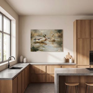 a modern kitchen with wooden cabinets, a large window, and a painting of ducks swimming in a pond hanging on the wall.
