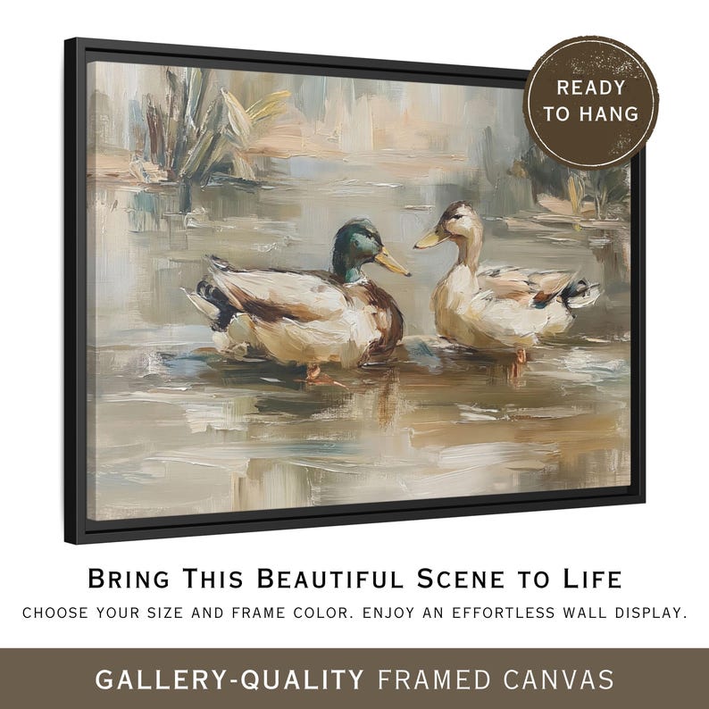 The image is a framed canvas depicting two ducks swimming in a body of water, with a text overlay that reads "Bring This Beautiful Scene to Life" and "Choose your size and frame color. Enjoy an effortless wall display."