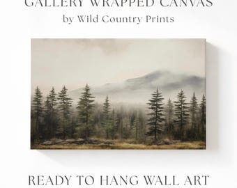 May include: A gallery wrapped canvas wall art piece by Wild Country Prints featuring a landscape painting of a misty forest with tall pine trees and a mountain in the background. The scene is rendered in muted earth tones, browns, and grays.