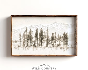 Könnte beinhalten: Ein rechteckiges Wandbild mit einer einfarbigen Landschaftsillustration von Kiefern und Berggipfeln in Braun- und Cremetönen, eingefasst in einen dunkelbraunen Holzrahmen. Der Text WILD COUNTRY COLLECTIVE ist darunter aufgedruckt.