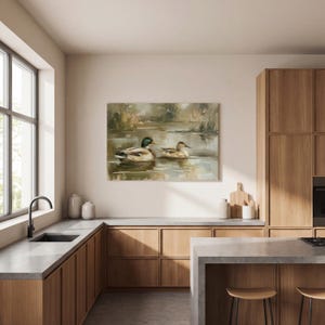 a modern kitchen with wooden cabinets, a large window, and a painting of ducks on the wall.