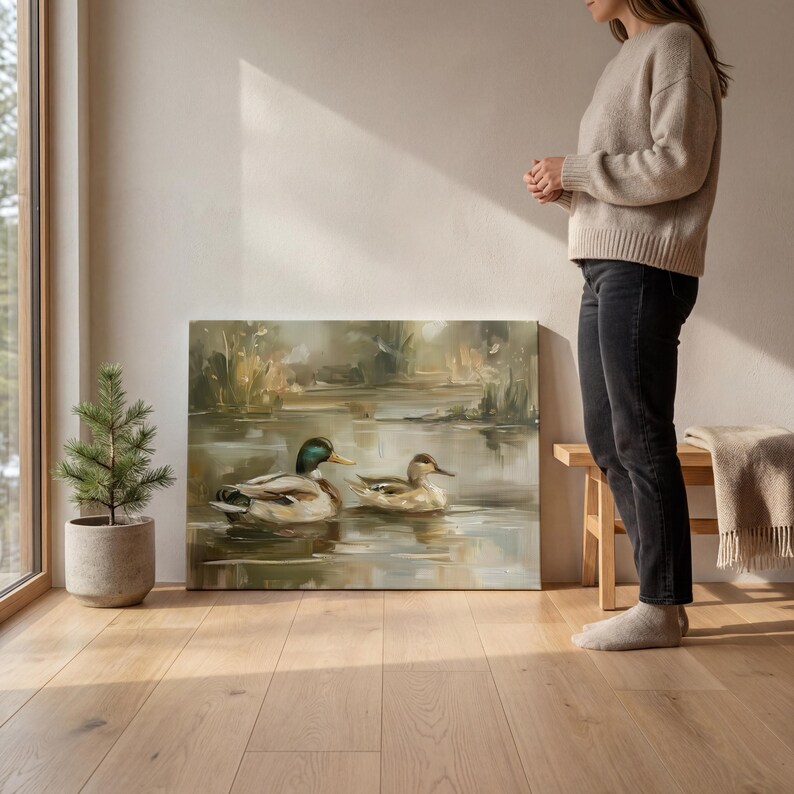 A woman stands in a room with a large painting of ducks on a wooden floor, next to a potted plant and a wooden bench.