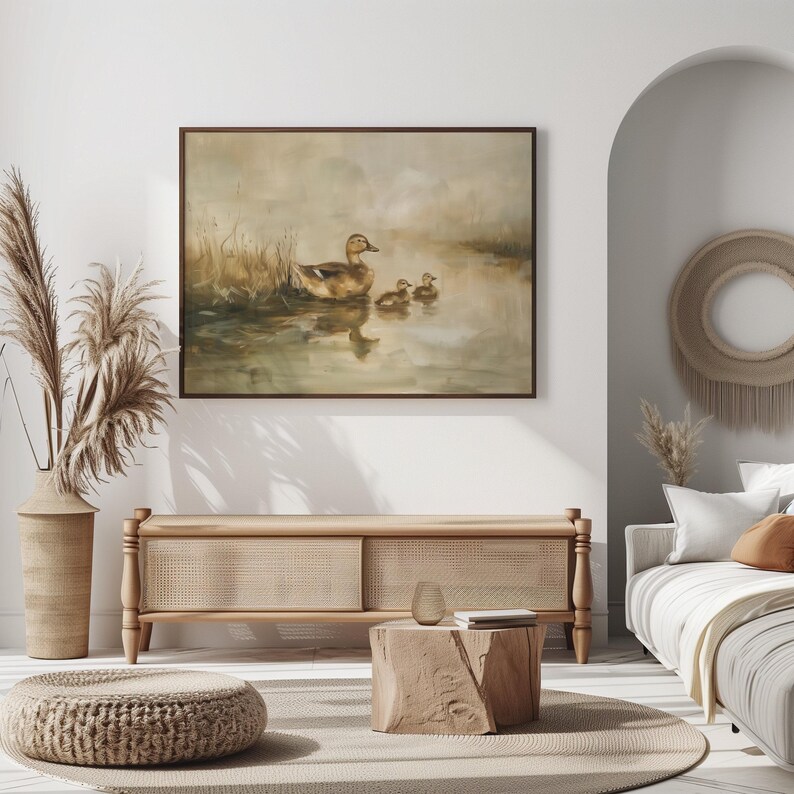 a living room with a couch and a painting on the wall