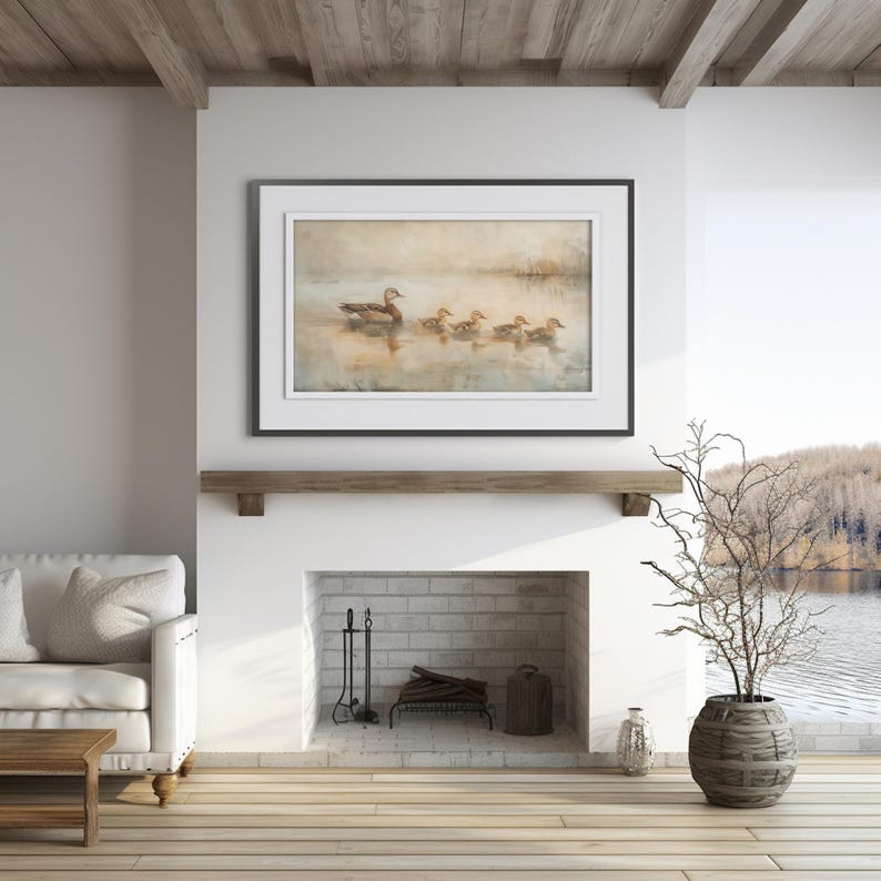 a living room with a fire place and a painting on the wall