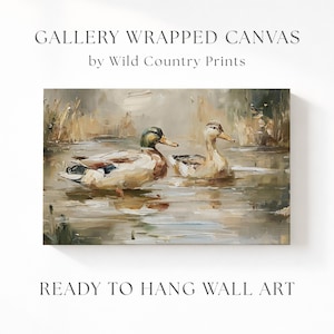 The image is a painting of two ducks swimming in a body of water, with the text "GALLERY WRAPPED CANVAS by Wild Country Prints" and "READY TO HANG WALL ART" below it.