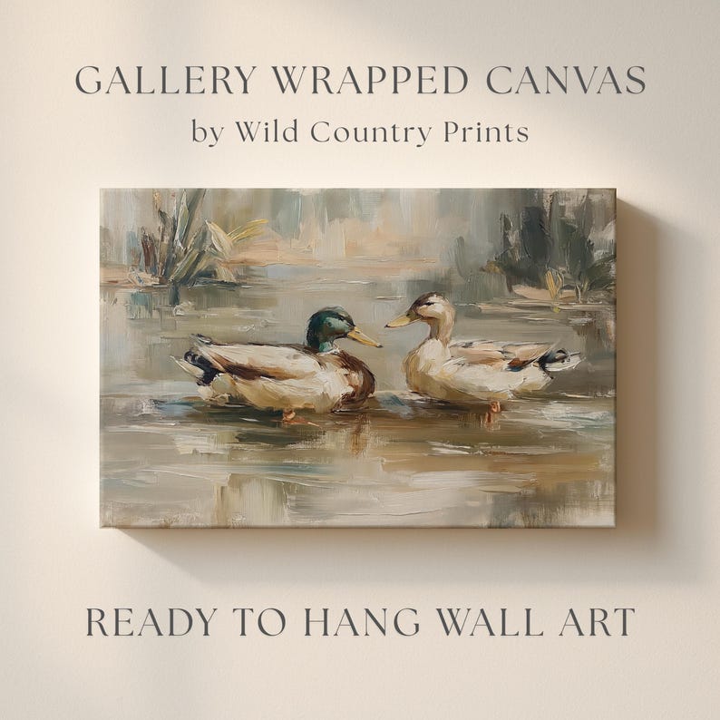 The image is a painting of two ducks swimming in a body of water, with the text "GALLERY WRAPPED CANVAS by Wild Country Prints" and "READY TO HANG WALL ART" below it.