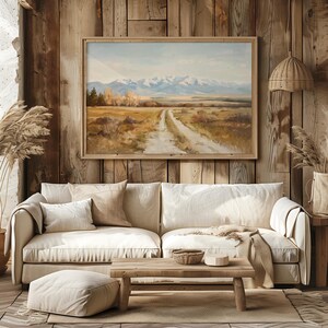 a painting of a dirt road with mountains in the background