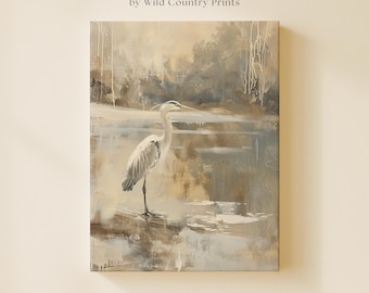 May include: A gallery wrapped canvas wall art print by Wild Country Prints featuring a painting of a heron standing in shallow water. The artwork uses a neutral color palette of beige, grey, and white with visible brushstrokes and drips.