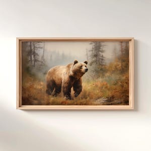 a painting of a bear is hanging on a wall