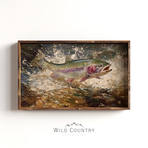 May include: A framed oil painting depicting a rainbow trout leaping from splashing water. The fish features a speckled body with a pink lateral stripe. The scene is rendered with visible brushstrokes in shades of brown, white, and green, enclosed in a dark brown wooden frame.