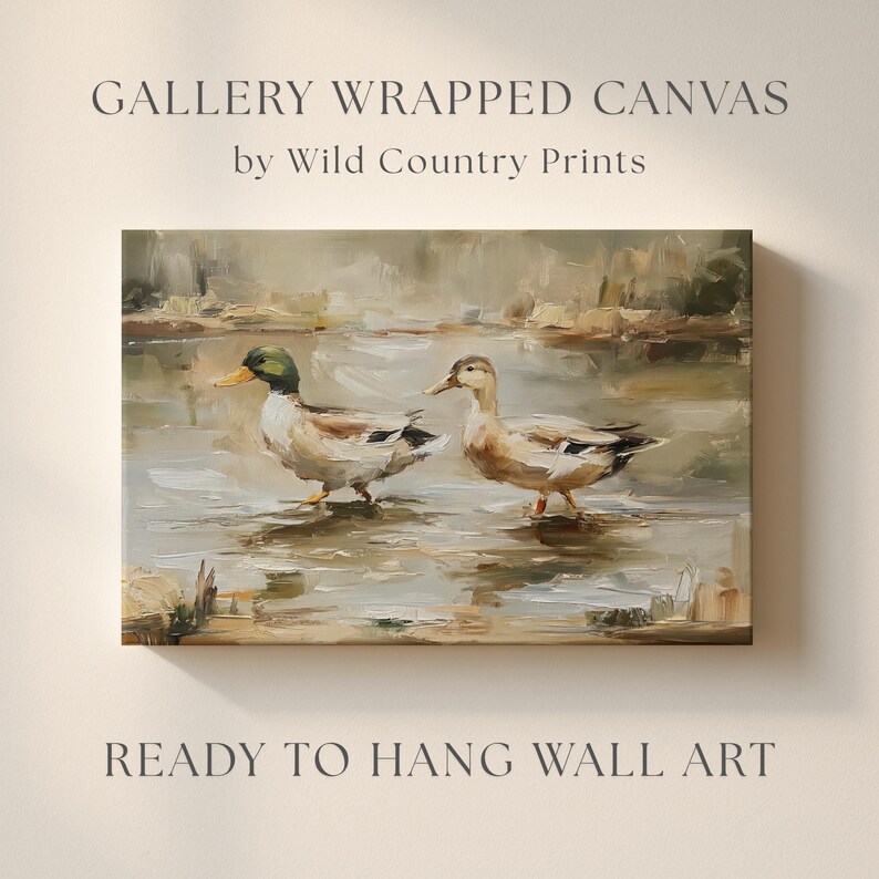 The image is a painting of two ducks in a body of water, with the text "GALLERY WRAPPED CANVAS by Wild Country Prints" and "READY TO HANG WALL ART" below it.