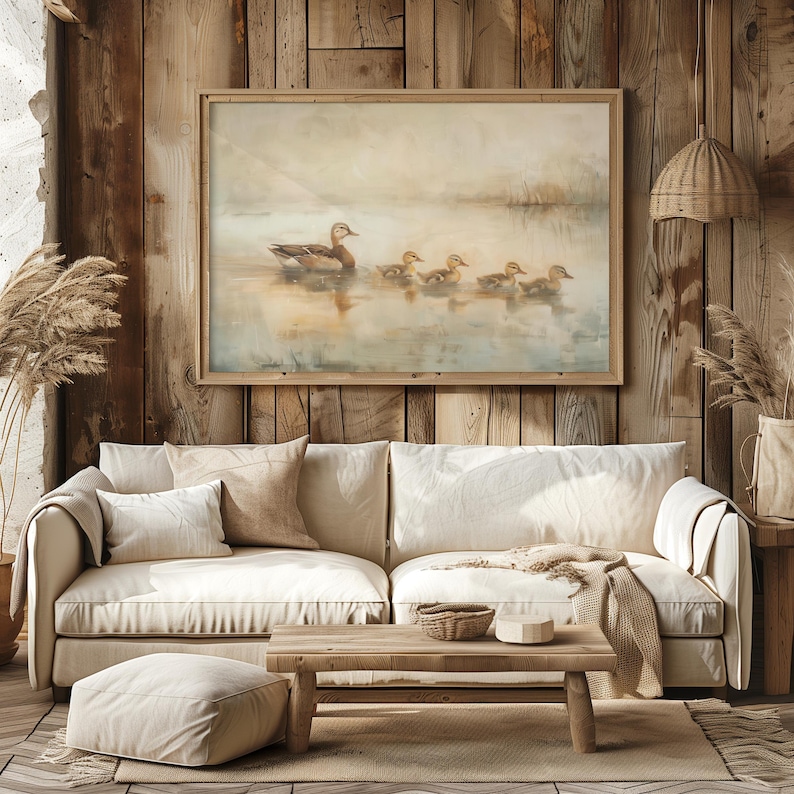 a living room with a couch and a painting on the wall