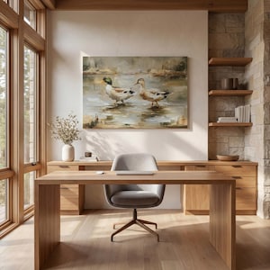 a serene and modern workspace with a large painting of ducks on the wall, a wooden desk with a chair, and a vase of flowers on the desk.