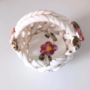 Ceramic basket originally from Spain. Very old. Traditional art. With floral motifs. Vintage Art Deco pottery.