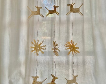 woven bamboo holding mobile: horses, stars and flowers