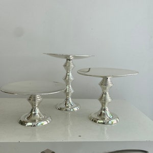 3 different sizes of silver plated cake, cookie and fruit stands.