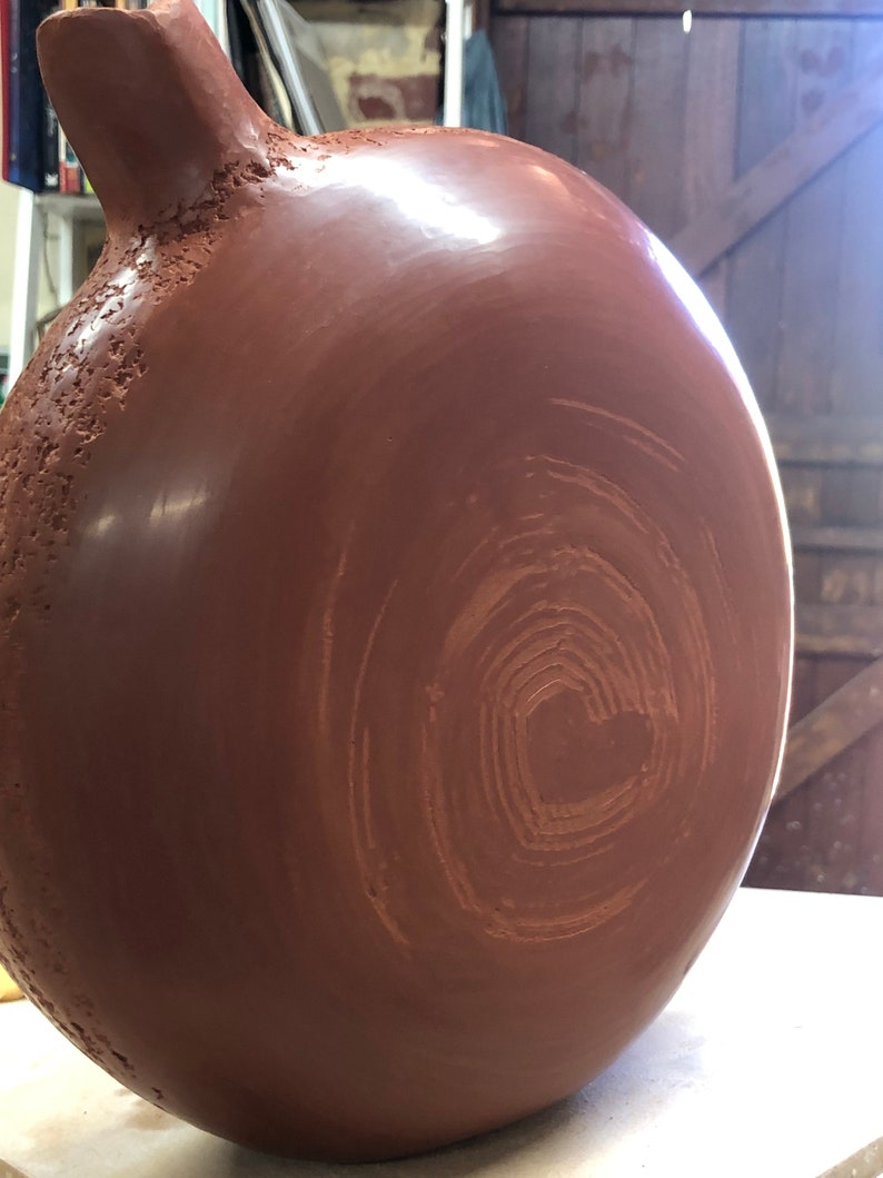 Sienna ceramic vase in the studio.