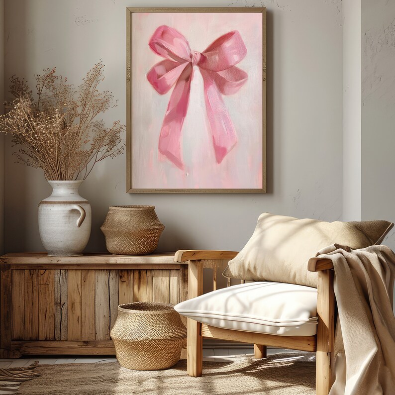 May include: A painting of a large pink bow on a light pink background. The bow is tied with a single knot and the ends of the ribbon are flowing down.