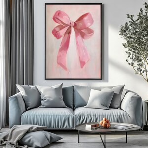 May include: A painting of a large pink bow on a light pink background.