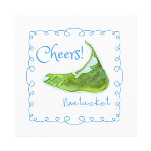 May include: A white card with a blue border featuring a green and blue watercolor illustration of the island of Nantucket. The card says "Cheers!" and "Nantucket" in blue text.