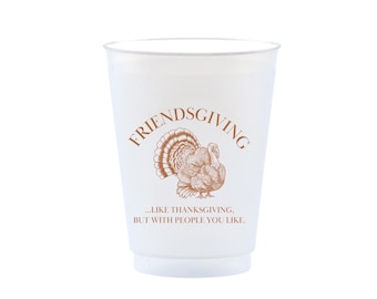 May include: A white plastic cup with the word "FRIENDSGIVING" in brown script above a brown turkey illustration. Below the turkey is the text "...LIKE THANKSGIVING, BUT WITH PEOPLE YOU LIKE."