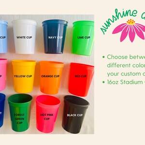 May include: A collection of twelve 16oz stadium cups in various colors, including sky blue, white, navy, lime, pink, yellow, orange, red, transparent blue, forest green, hot pink, and black. The image includes the text "Choose between 12 different colors for your custom cups."