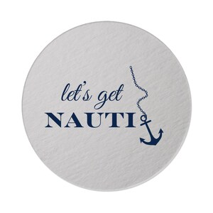 May include: Round white coaster with the text "let's get NAUTI" in navy blue lettering. A navy blue anchor with a chain is hanging above the text.