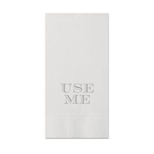 May include: White hand towel with the text "USE ME" printed in gray.