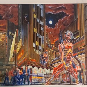 May include: A vintage album cover featuring a futuristic cityscape with a skeletal figure holding a gun. The figure is made of muscle and bone, and the city is filled with neon signs and advertisements. The album title "Iron Maiden" is visible in the upper right corner.
